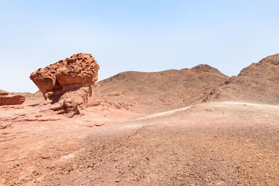 Rock formations in desert against sky