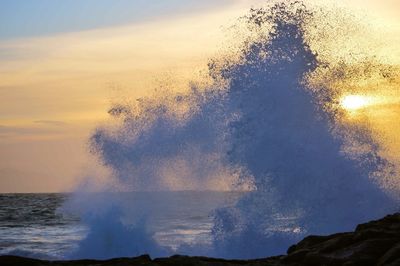 Scenic view of sea at sunset