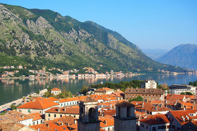 Houses by river and mountains at kotor bay