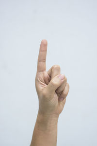 Close-up of human hand against white background