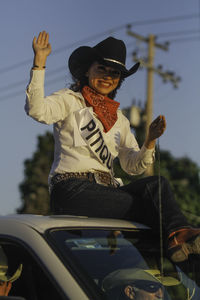 Portrait of smiling woman in car