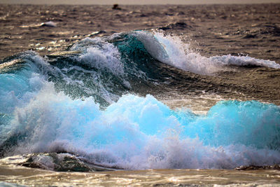 Waves splashing on rocks