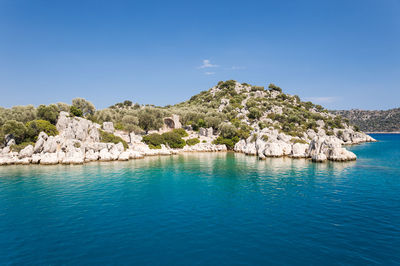 Scenic view of sea with mountain range in background