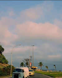 Cars on road against sky