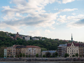 Houses against sky in city