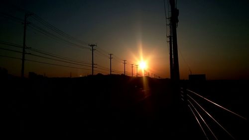 Electricity pylon at sunset