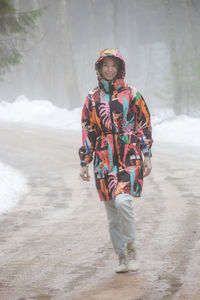 Rear view of man standing at beach