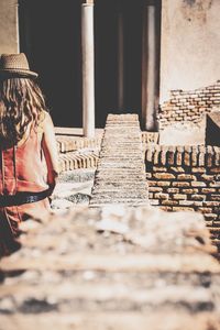 Woman standing against wall