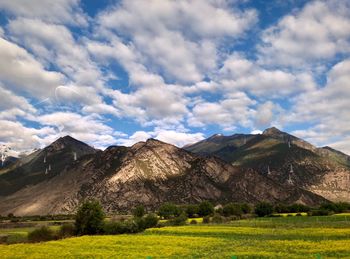 View of landscape against cloudy sky