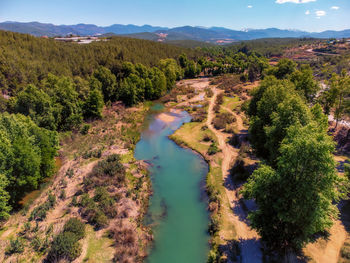 High angle view of trees and mountains against sky