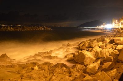 View of illuminated rocks at night