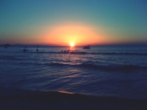 sea, horizon over water, sunset, water, scenics, sun, beauty in nature, tranquil scene, tranquility, orange color, beach, idyllic, wave, nature, sky, shore, silhouette, reflection, clear sky, seascape