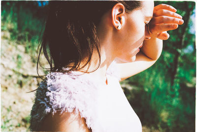 Close-up of woman holding camera