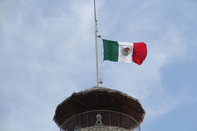 Low angle view of flag against sky