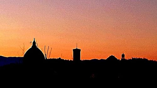 Silhouette of building at sunset