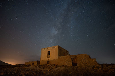 Low angle view of building against sky at night