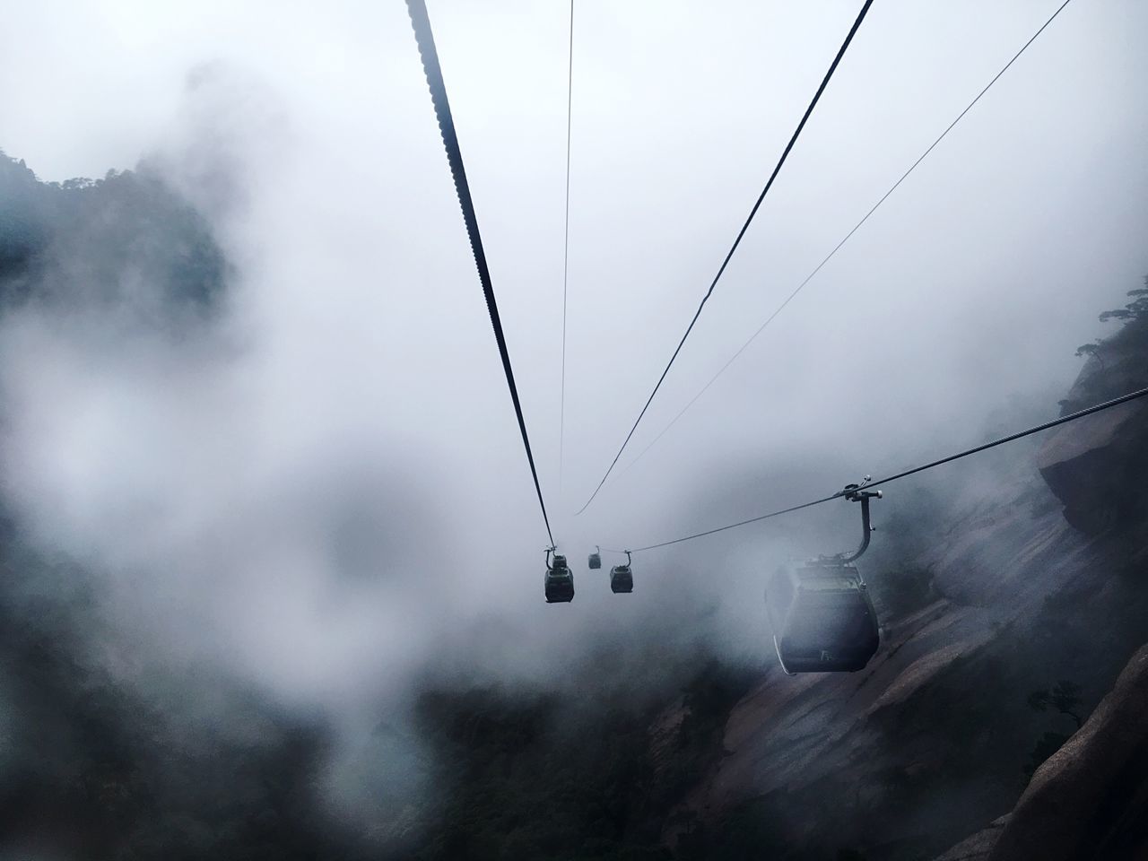 fog, overhead cable car, weather, hanging, sky, outdoors, day, nature, cable, low angle view, transportation, no people, cold temperature, ski lift, mountain, beauty in nature, tree