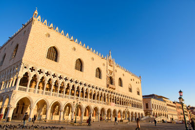 Exterior of historic building against clear blue sky