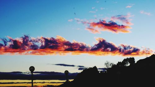 Scenic view of silhouette trees against sky