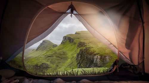 Scenic view of mountain seen through window