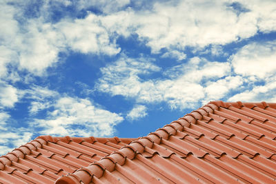 Low angle view of roof and building against sky