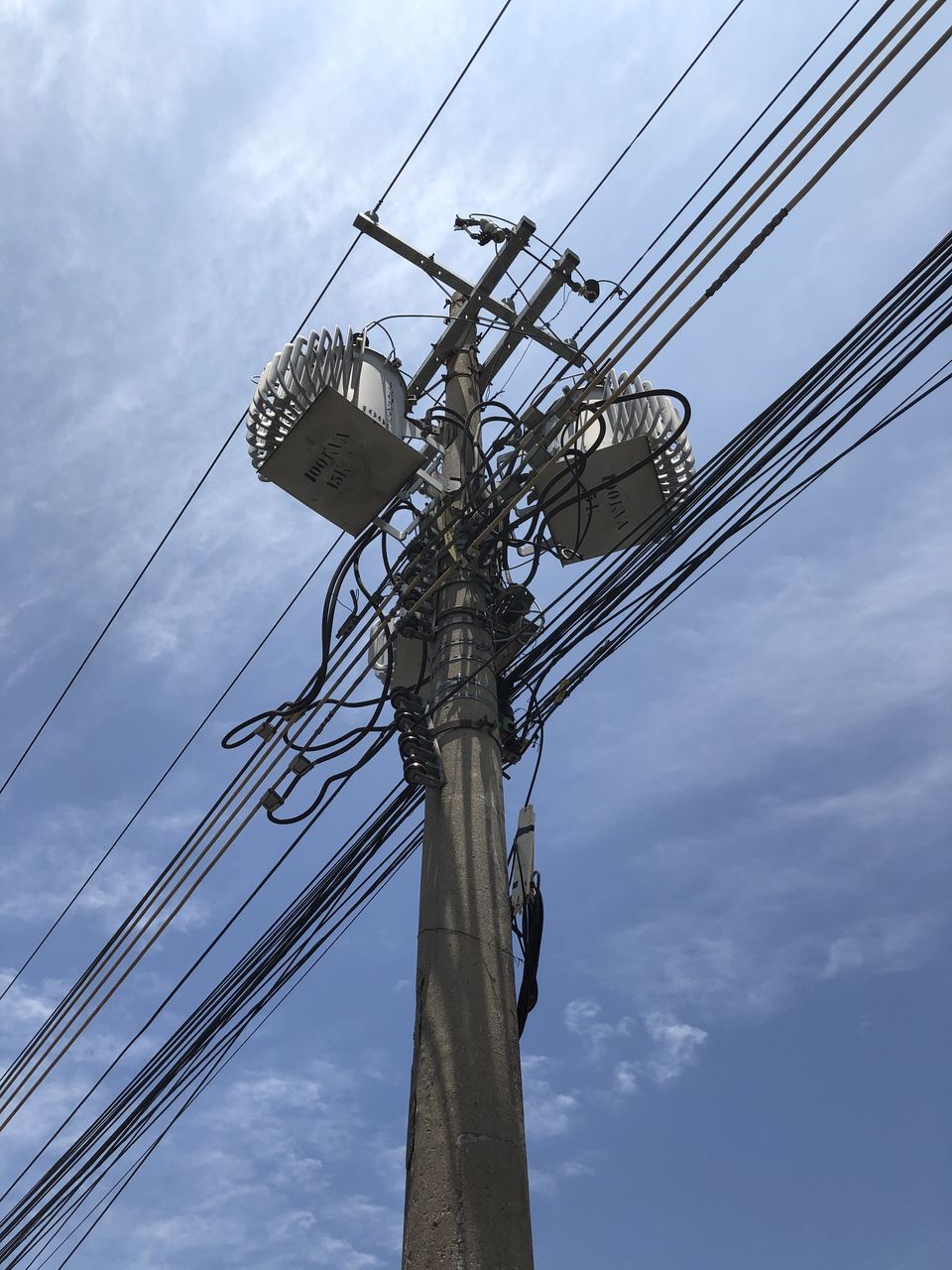 LOW ANGLE VIEW OF COMMUNICATIONS TOWER AGAINST SKY