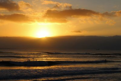 Scenic view of sea at sunset