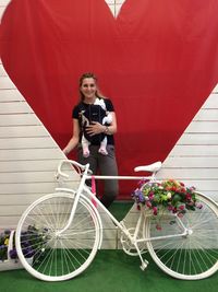 Portrait of a young woman riding bicycle