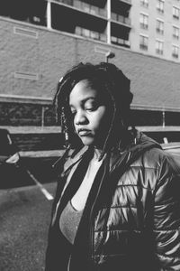 Close-up of young woman standing outdoors