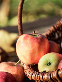 Close-up of apples on wicket basket