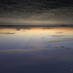 Scenic view of sea at sunset