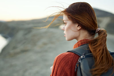 Portrait of young woman looking away