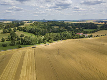 Scenic view of agricultural landscape against sky