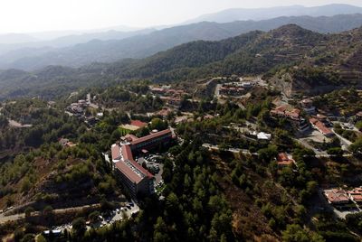 High angle view of townscape and mountains