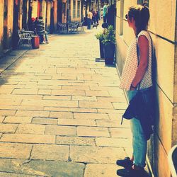 Woman on road in city