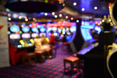 Blurred motion of illuminated lights on table at night