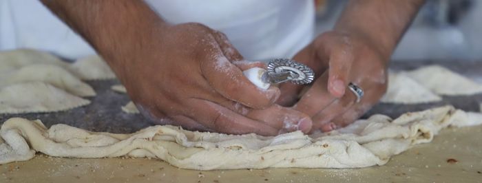Close-up of man preparing food