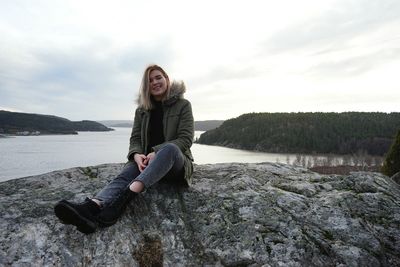 Portrait of woman sitting on beach