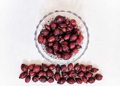 High angle view of strawberries on table against white background