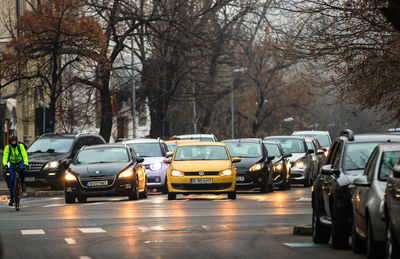 View of cars on street in city