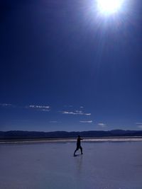 Man on water against sky