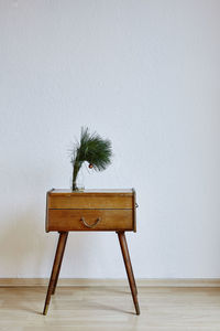 Chair on table against wall at home