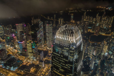 Aerial view of illuminated buildings in city at night