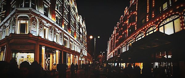 Low angle view of illuminated building at night