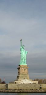 Low angle view of statue against cloudy sky