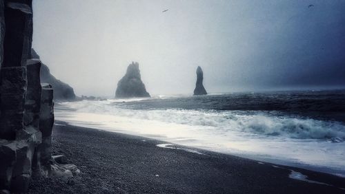 Scenic view of beach against clear sky