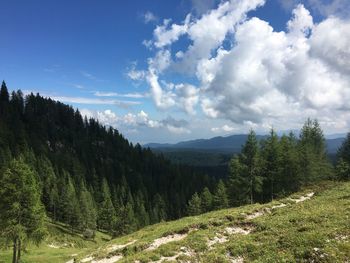 Scenic view of landscape against cloudy sky