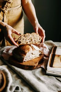 Close-up of person preparing food on cutting board