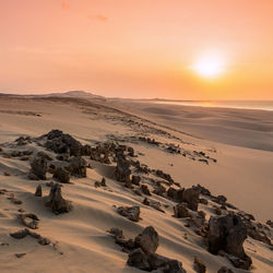 Scenic view of landscape against sky during sunset