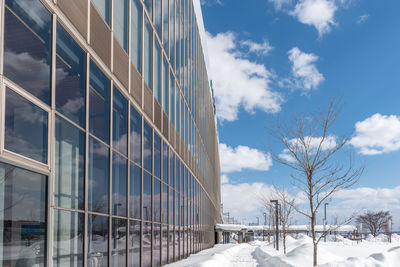 Snow covered buildings against sky